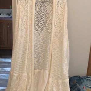 Ivory sweater long with extra detail along bottom